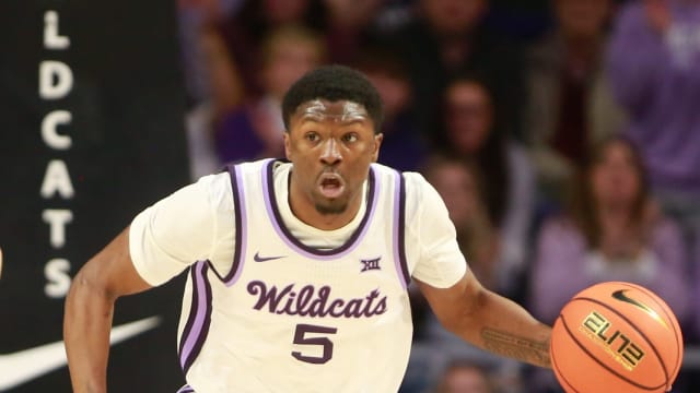 Kansas State junior guard Cam Carter (5) dribbles back a Kansas rebound in the first half of the Sunflower Showdown inside Bramlage Coliseum Monday, February 5, 2024.